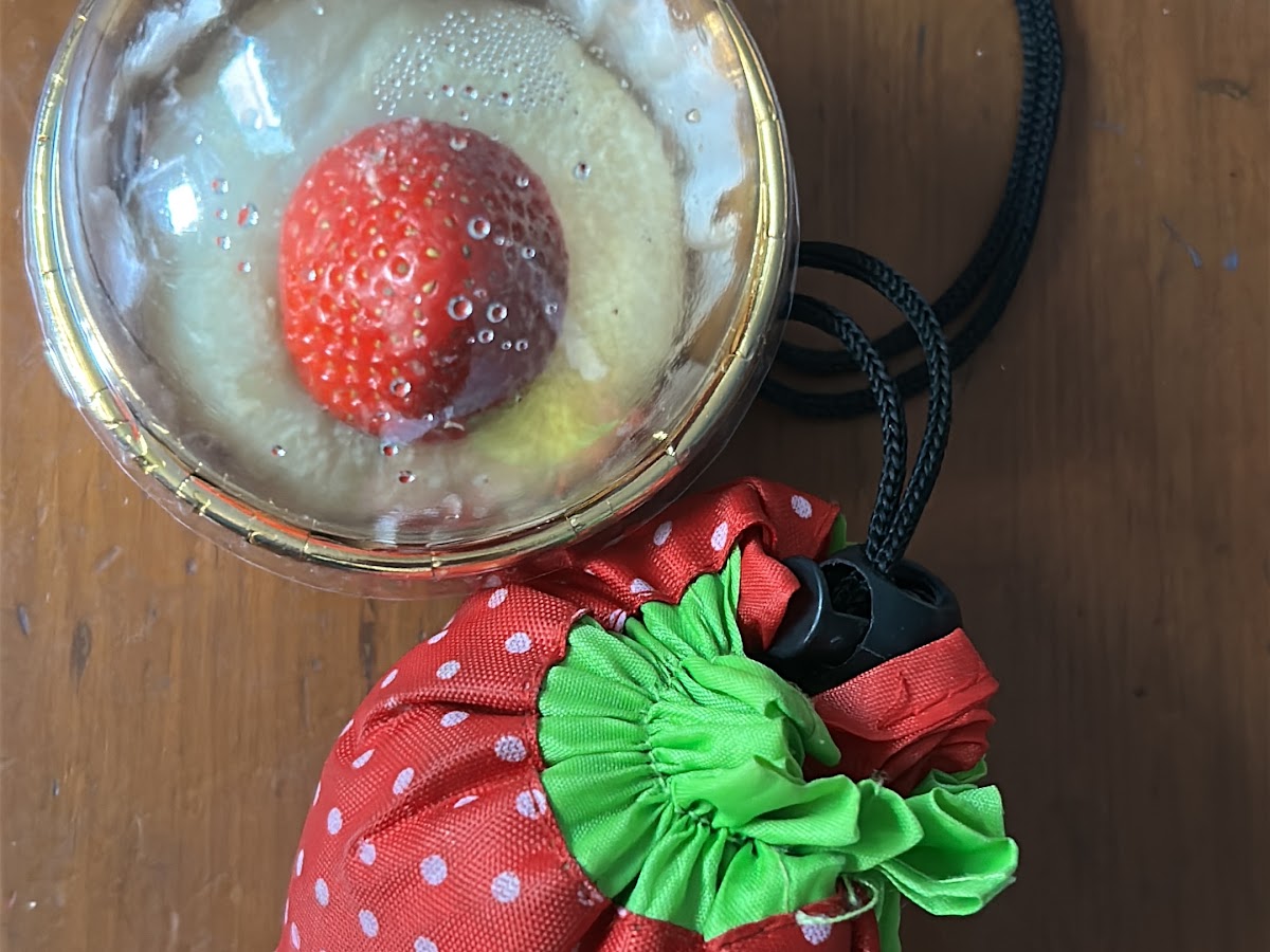A strawberry-topped smoothie photographed at Gleam & Sip by Google reviewer Rachel Godley
